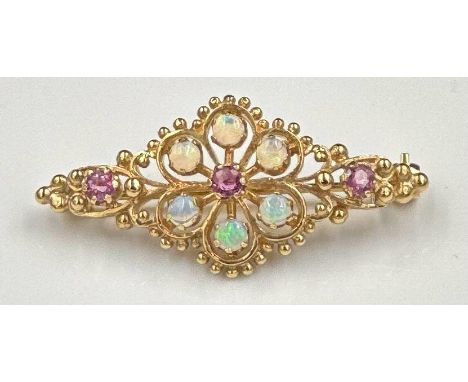 A beautiful opal and garnet brooch on 9ct yellow gold, approximate total weight 4.9g and 38mm in width.