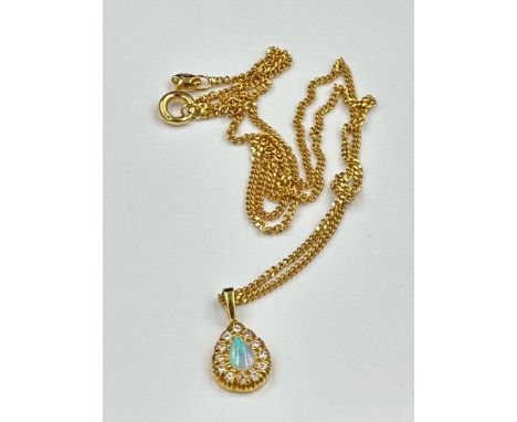 An 18ct yellow gold fine necklace with opal and diamond pendant, approximate weight 4.8g