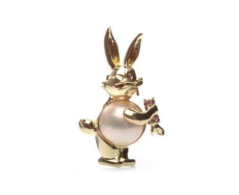 MABE PEARL AND RUBY BUNNY BROOCH, the Mabe pearl 13mm diameter forming the body of the bunny, holding a carrot set with round