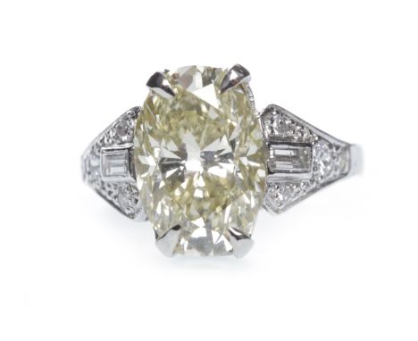 GIA CERTIFICATED YELLOW DIAMOND RING, the oval diamond of approximately 3.02 carats with accompanying report number 515133011