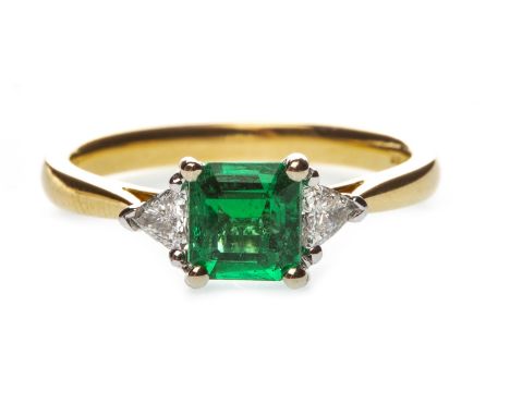 EMERALD AND DIAMOND THREE STONE RING, the step cut emerald flanked by two trillion cut diamonds totalling approximately 0.20 