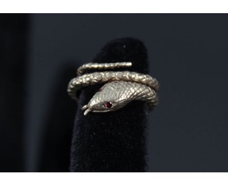 A 9ct gold snake ring with garnet eyes, size H (possible repair to body)