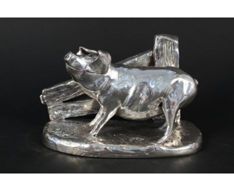 A large filled silver model of a pig
