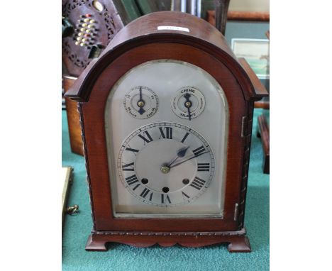 A mahogany cased striking mantel clock