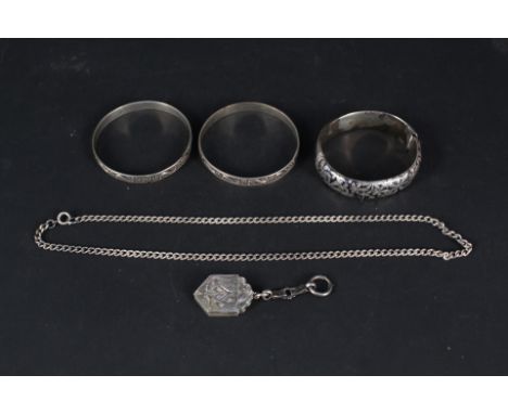 Mixed silver and white metal jewellery including a Niello decorated bangle, two other foliate decorated bangles plus a double
