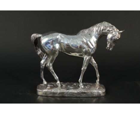 A large filled silver model of a horse