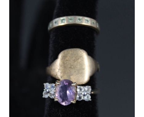 A 9ct gold purple and white stone set ring size O, a 9ct gold eternity ring plus a gents yellow metal signet ring (as found)