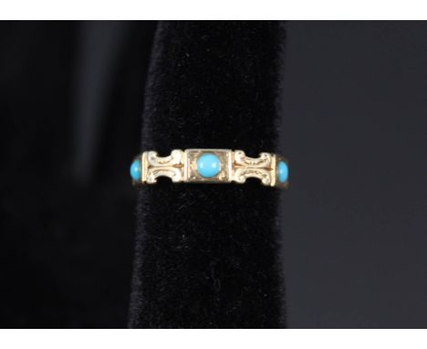 An unmarked band ring set with multiple turquoise stones, size M