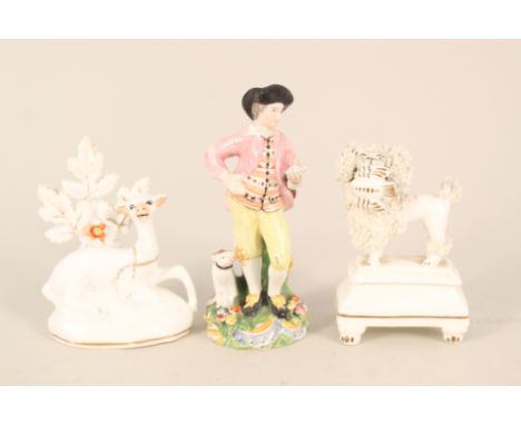 An early 19th Century porcelain figure of a man and dog (light restoration), a sheep and bocage figure plus a poodle on stand