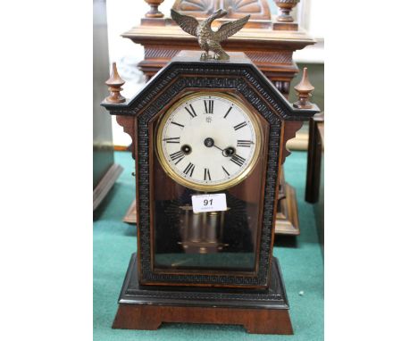 A Junghams mantel clock with brass eagle finial