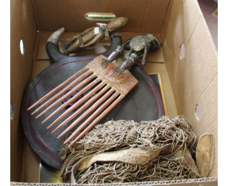 A Ghanaian large figural comb, a small Ibeji figure, a bead and string skirt plus a large West African mask