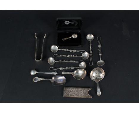 A mixed silver and white metal lot including three caddy spoons (two are as found), six white metal spoons with floral and in