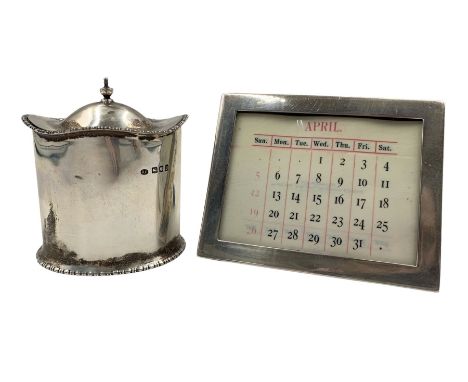 Small silver tea caddy of serpentine outline with hinged lid H7cm London 1917 Maker Josiah Williams & Co and a perpetual cale