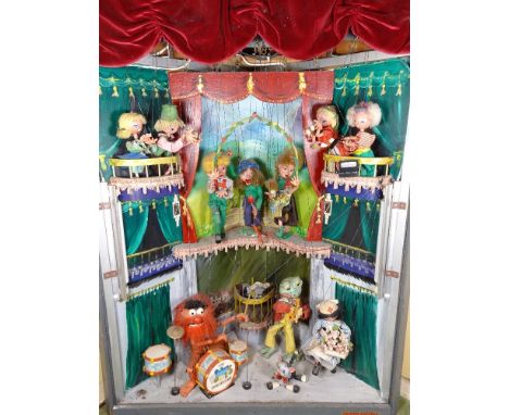 A large Pelham Puppet electric driven Shop display animated unit, early 1970s, the wooden corner display unit with painted sc