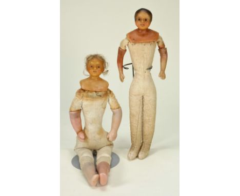 Two Early bees wax shoulder head dolls, English circa 1850, the first with painted features, bead eyes and short brown hair-s