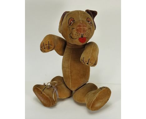 A Chad Valley Bonzo, 1930s, the cream velvet dog with black ears, printed features with red felt tongue, swivel head and join