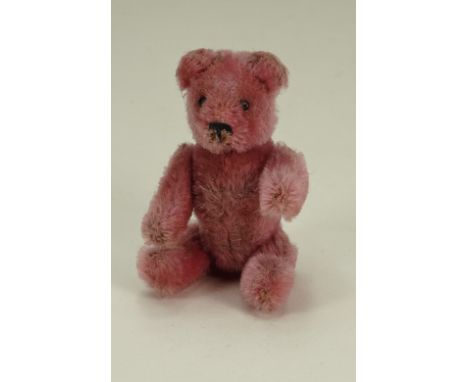 Rare miniature pink mohair Schuco Teddy bear compact, German 1920s, with black metal eyes, stitched nose and mouth and swivel