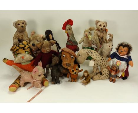 A collection of various soft toys, including a 1930s piglet with velvet head and trotters, glass eyes, pink felt nose and on 