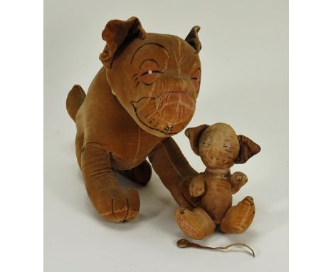 A Chad Valley Bonzo, 1930s, the seated cream velvet dog with black ears, printed features, and original collar with Dean’s bu