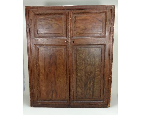 A rare and early 19th century English Dolls House cupboard and contents, the painted natural wood effect exterior with two hi