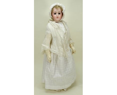 A beautiful early portrait Jumeau bisque shoulder head fashion doll, French circa 1870, with fixed brown glass paper-weight e