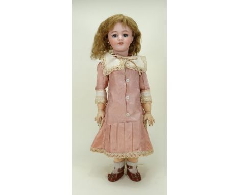 DEP bisque head doll, German for the French market, circa 1910, with weighted blue glass eyes, real lashes, raised brows, ope