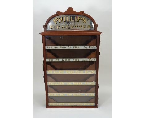 A Phillips’ Cigarettes six drawer wall cabinet dispenser, early 20th century, the wooden framed cabinet with Phillips’ Cigare