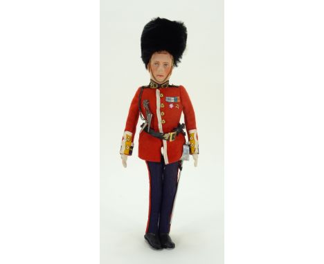 Farnell Alpha Toys King George VI felt portrait doll, circa 1937, moulded felt face with painted features and hair, swivel he