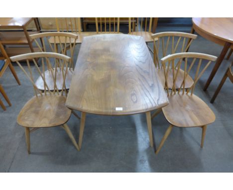 An Ercol drop leaf table and four chairs