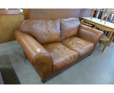 A Laura Ashley brown leather sofa