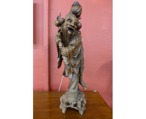 A Chinese carved wood table lamp