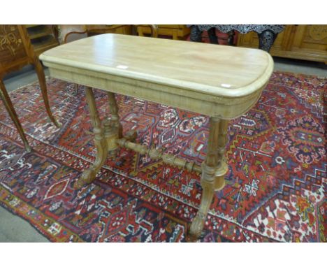 A Victorian walnut fold-over card table