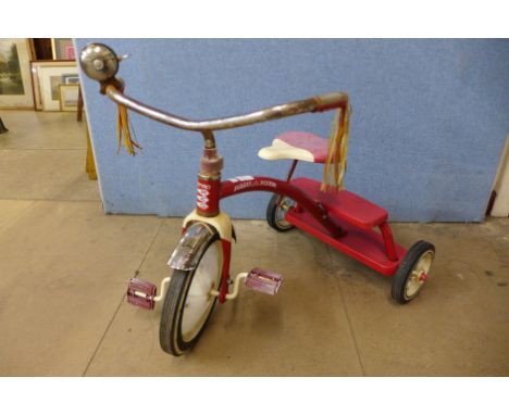 A vintage Radio Flyer child's tricycle