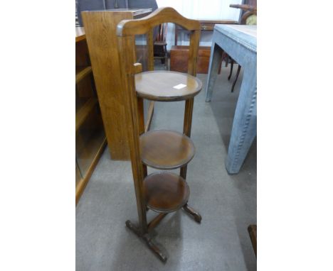 A mahogany folding cake stand