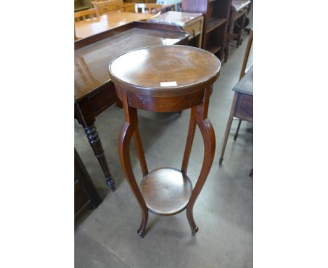 A mahogany jardiniere stand