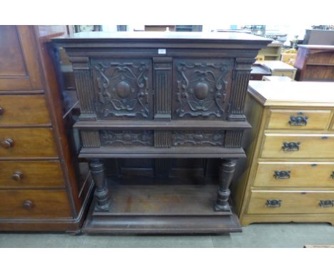 A 19th Century Flemish carved oak cupboard on stand