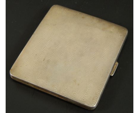 A George V silver cigarette case, with engine turned body, Birmingham 1933, 3½oz gross.  (M)