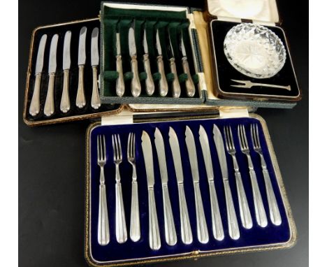 Various cased cutlery sets, comprising a cased set of six silver handled butter knives, a set of six old English pattern silv