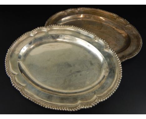 A pair of late Victorian silver oval platters or meat dishes, each with a gadrooned border, London 1898 by R & G Garrard & Co