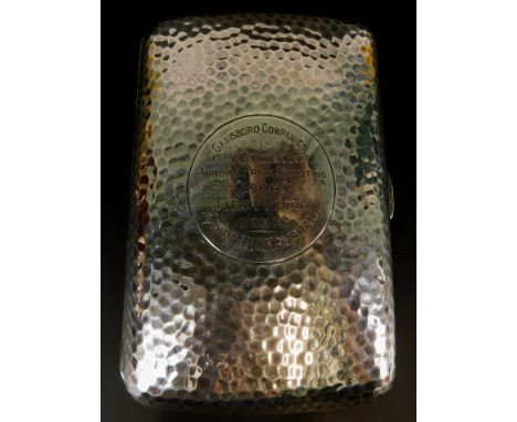 An Edwardian rectangular silver cigarette case, with hammered decoration, engraved to a circular cartouche, Gainsborough Comp