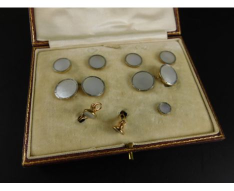 A part cased set of Mappin & Webb cufflinks and collar studs, each with circular mother of pearl on yellow metal back, marked