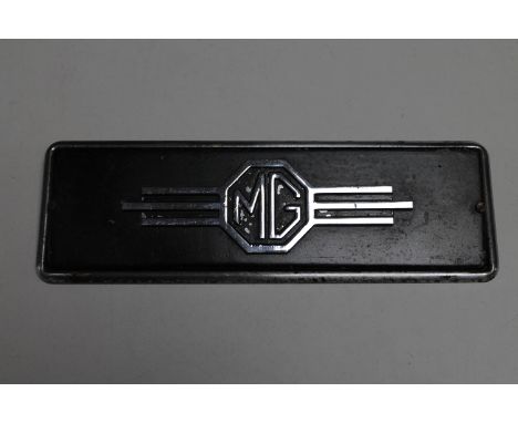 An MG car badge