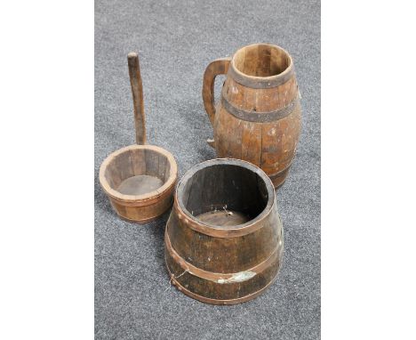 A coopered oak jug, ladle and planter