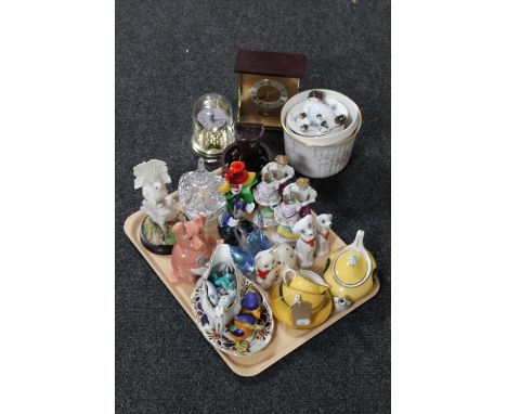A tray of Murano glass clown, continental figures, mantel clocks, crystal trinket dish, money boxes