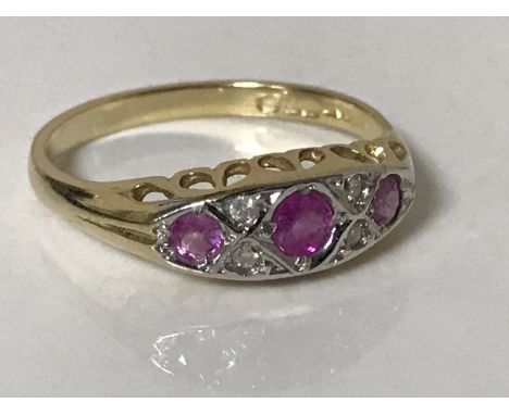 An 18ct gold ruby and diamond ring