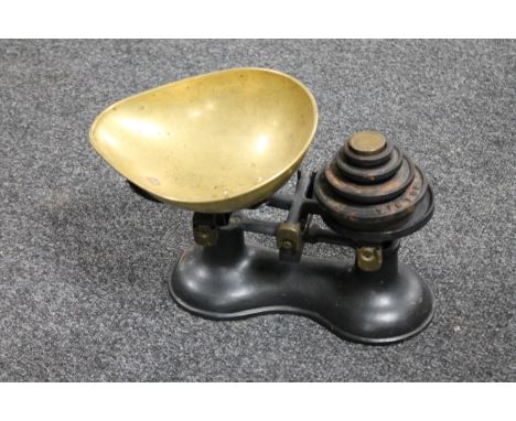 A set of antique kitchen scales with weights
