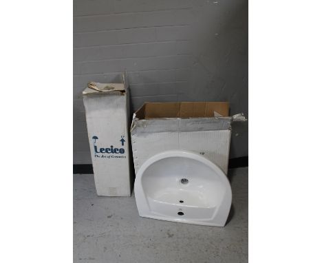 A boxed ceramic wash basin and pedestal 