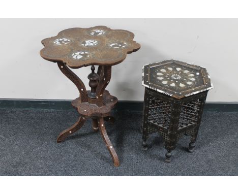 A Moorish carved, brass and mother of pearl inlaid occasional table, together with another similar