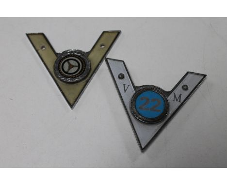 Two vintage car badges 
