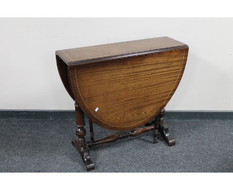 An inlaid mahogany drop leaf table together with a vintage style telephone 